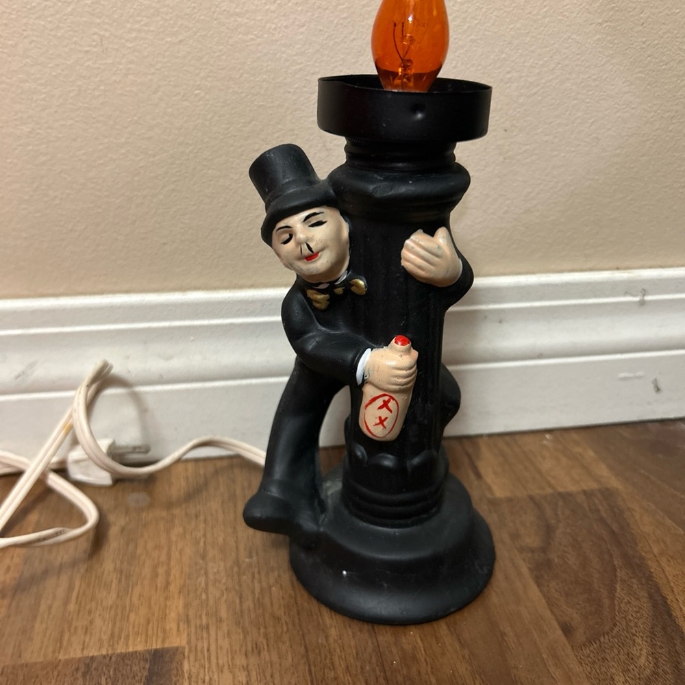 Vintage drunk Charlie Chaplin Lamp with orange bulb - no shade